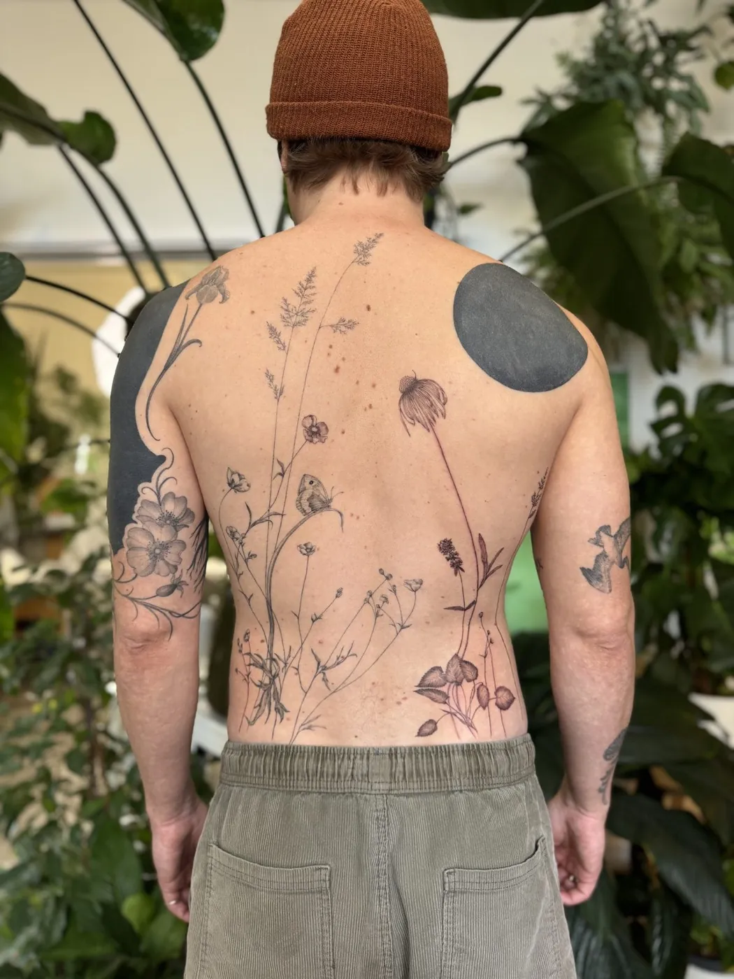 Wildflower meadow back tattoo by Gosia, Bristol