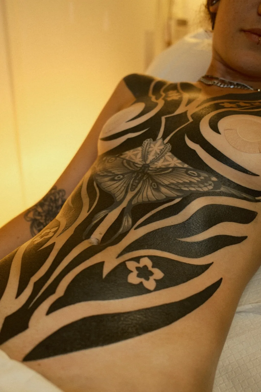 Bold blackwork full torso tattoo by Simon, four sessions, Bristol