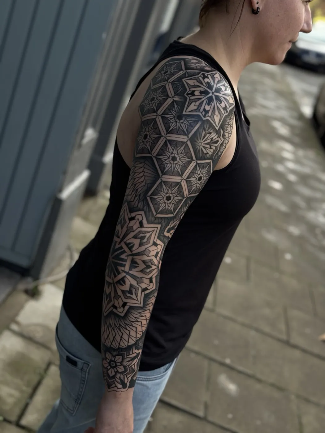 Geometric blackwork full sleeve by Simon, Bristol